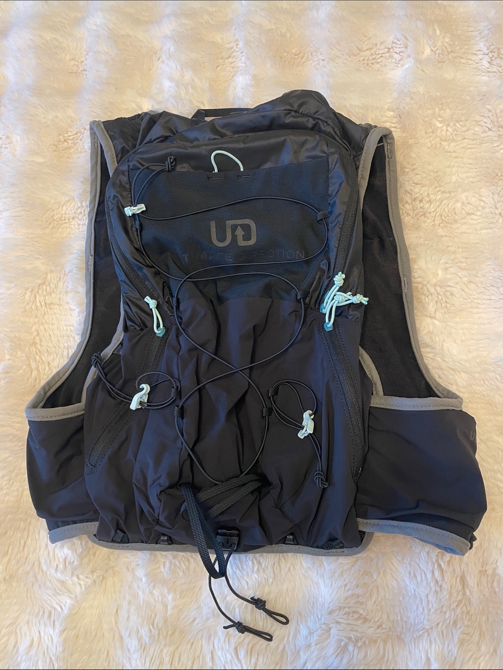 Ultimate Direction Black Women's running Vest with Mint Accents